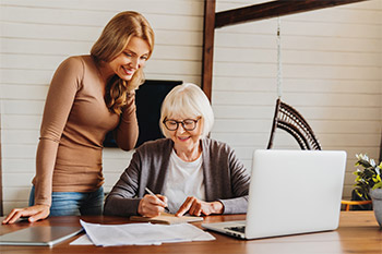 Woman Helping an Older Lady